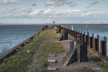Low tide at the Portishead Pier with the Bristol Channel and the Prince of Wales bridge in the...