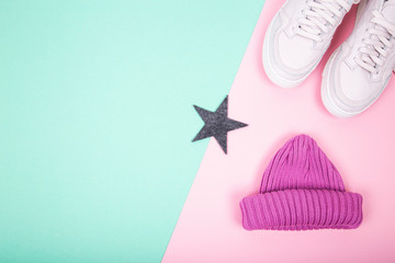 One knitted purple hat with pink sneakers.