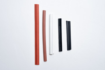 Various types of seals for doors, windows, parts, appliances and plumbing on a white background