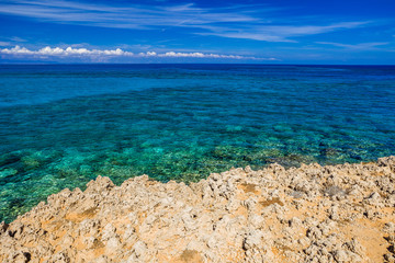 Sea stone coast and clear turquoise water.