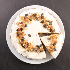 carrot cake with cream and nuts, slice