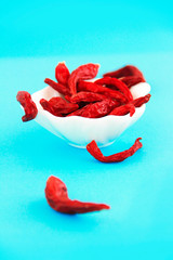 natural dried red small hot pepper in a decorative white plate