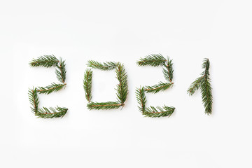 Number of new year 2021 made of fir branches. Flat lay, top view