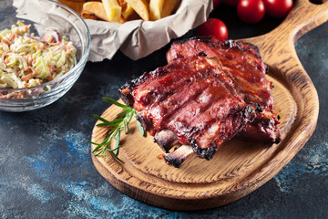 Spicy barbecued pork ribs served with BBQ sauce