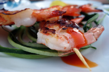 Grilled tasty shrimps with blur effect.