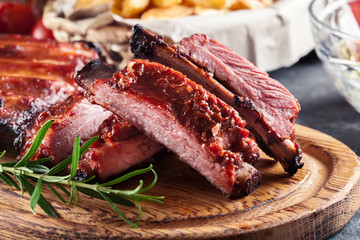 Spicy barbecued pork ribs served with BBQ sauce