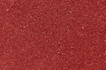 Weathered cement wall texture in red color.