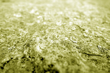 Marble stone background with blur effect in yellow tone.