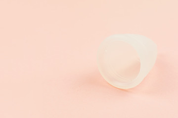 Fototapeta na wymiar Close up of menstrual cup on pink background