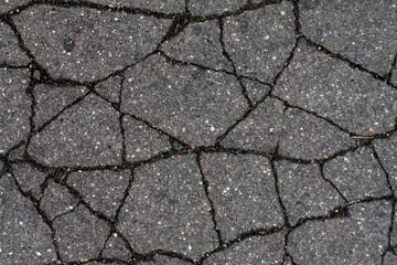 Damaged asphalt surface.