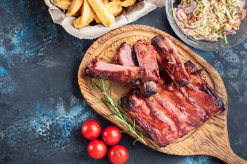Spicy barbecued pork ribs served with BBQ