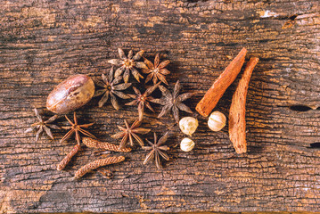 Closeup Dry spices or herbs on old wood background.; 