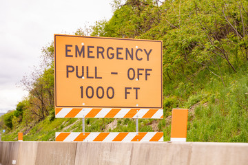 Emergency pull off 1000ft text, Warning road sign, highway in United states