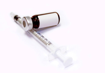 3 ml. Ampule of drug and plastic syringe with medical needle on white background.