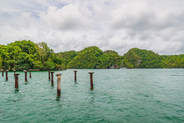 Luxury boat anchored close to exotic tropical forest. small islets where frigates and pelicans nest.Los Haitises natural park,Samana peninsula in Dominican republic.