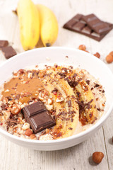 muesli, nuts, chocolate and banana, healthy breakfast