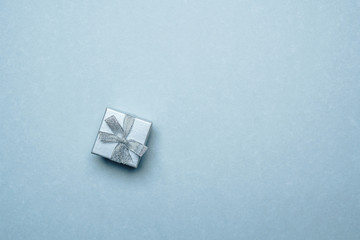 gift box on a plain blue background. monochrome