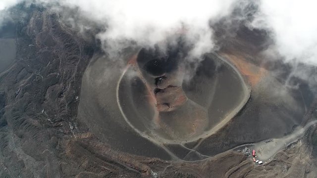 Aerial bird view footage of volcanic crater is an approximately circular depression in the ground caused by volcanic activity it is typically a bowl shaped feature within which occurs by vent or vents