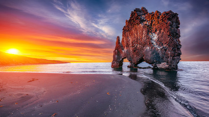 Dramatic sunset view of fHvitserkur unique basalt rock in Iceland