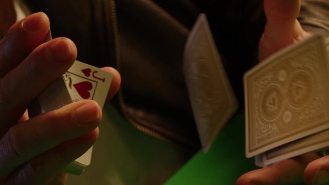 Flying cards slow motion shot, magician shows tricks, isolated, shot on Red Weapon Helium
