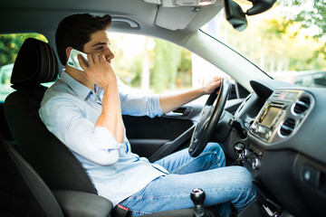 Man talking on the phone while driving car