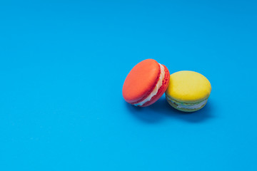 Flying macaroons with colorful backround
