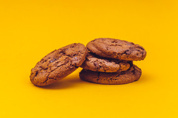 Chocolate cookies with yellow background