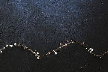 Christmas golden garland on a black background.