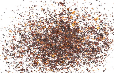 Dry red chili pepper flakes, cut up paprika pile isolated on white background, top view