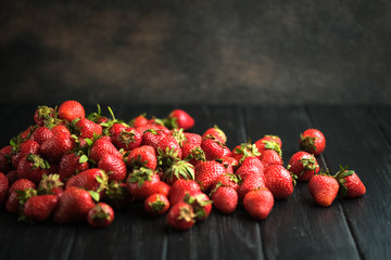 Healthy strawberry isolated on dark background. Copy space. High resolution product