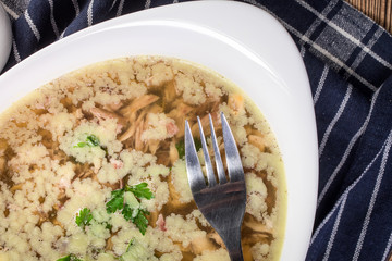 Homemade jelly meat on wooden table.