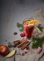 food photography of christmas still life side view with a glass of hot mulled wine with spices and...