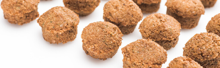close up view of delicious fresh cooked falafel balls on white background, panoramic shot