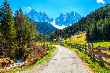 Alpine road with a beautiful view in Santa Maddalena village, Dolomites, Italy.