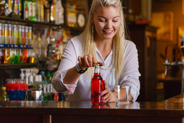 Woman working at the bar counter