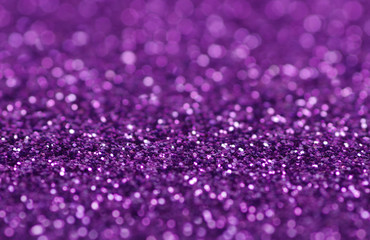 Purple glitter lights background. defocused