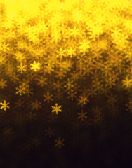 Gold snowflakes abstract glitter defocused lights.