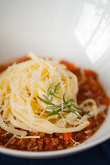Pasta with Bolognese Sauce and Parmesan. Sective focus