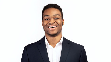 Young smiling black guy over white background