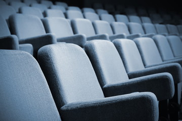 Empty rows of theater or movie seats.