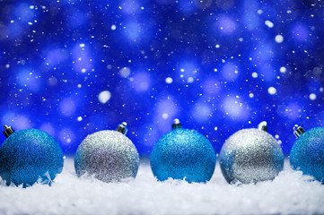 Fototapeta na wymiar Christmas, bright background with falling snow. Christmas toys Toys