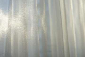 Curtains in the house at the window on a sunny day
