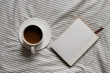 Obraz na płótnie Canvas cup of coffee in scandinavian style. Breakfast in bed