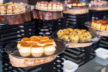 A delicious dessert buffet with various sweet bakery in a restaurant or hotel