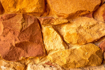 Stone texture. Brown and orange rock background. Surface of the rock. Close up of rock texture....