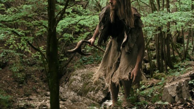 Slow Mo Caveman Waves Stick In Air