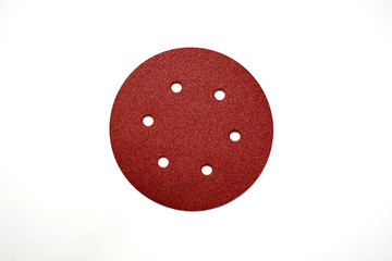 Set of other abrasive tools and sandpaper on a wooden background. The master is used to grind objects
