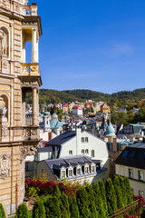 city views Karlovy Vary autumn. Czech Republic. Carlsbad. tree leaves in the foreground. Roofs of...