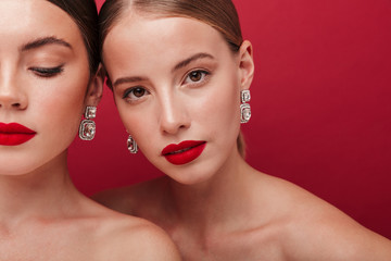 Beautiful young two women with bright red lipstick