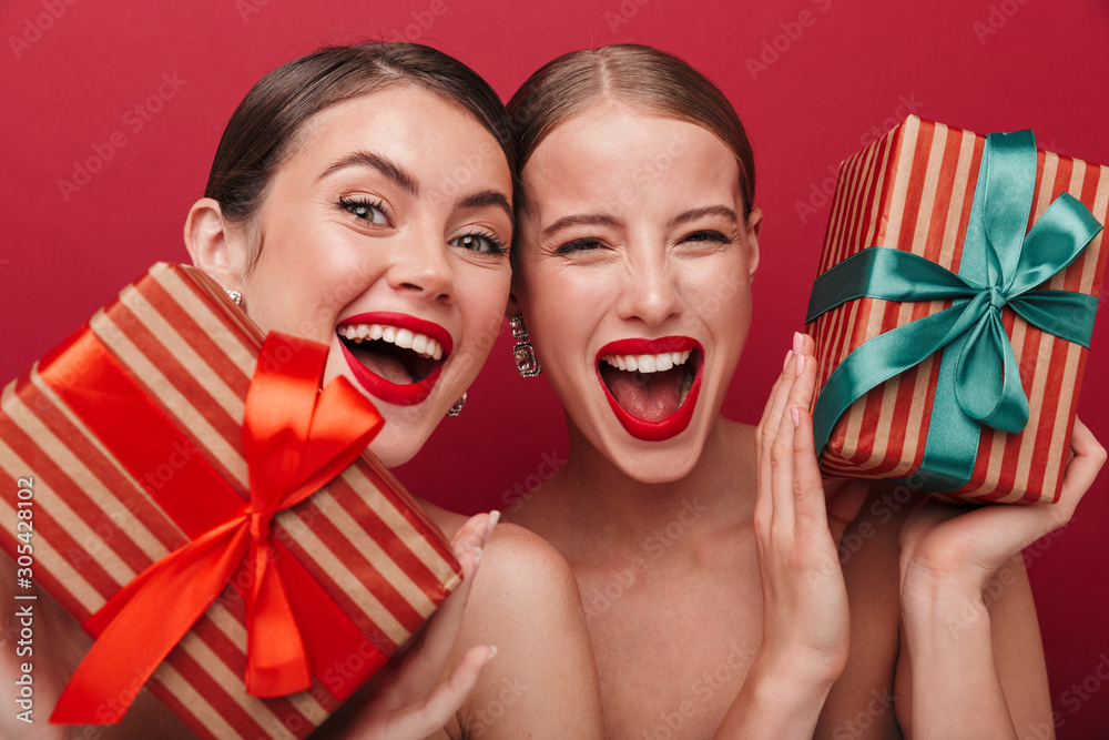 Wall mural amazing women with bright red lipstick holding gifts presents.